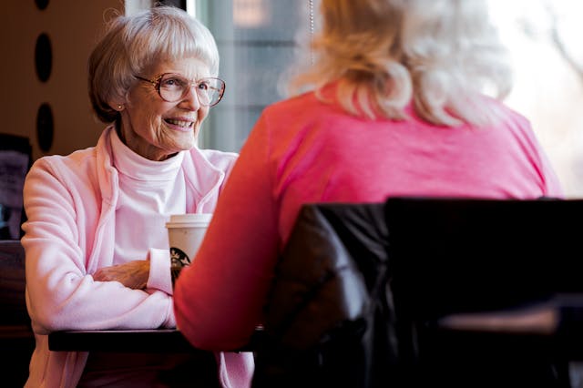 Resident and loved one enjoying a coffee